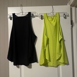 Fabletics Black and Neon Yellow workout Tank Tops with dolphin hem on sides